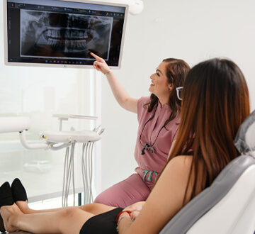 Dentist Explaining a Dental X-ray to the Patient at Polish Dentistry, Houston, TX