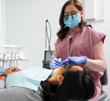 A Patient having a Dental Treatment from a Dentist at Polish Dentistry